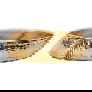 18K Gold Hammered Bangle Bracelet: 18K Gold Hammered Bangle BraceletOf bold minimalist design, the hand-hammered bracelet crafted in richly hued 18-karat yellow gold, centering a small rectangular panel set with three round