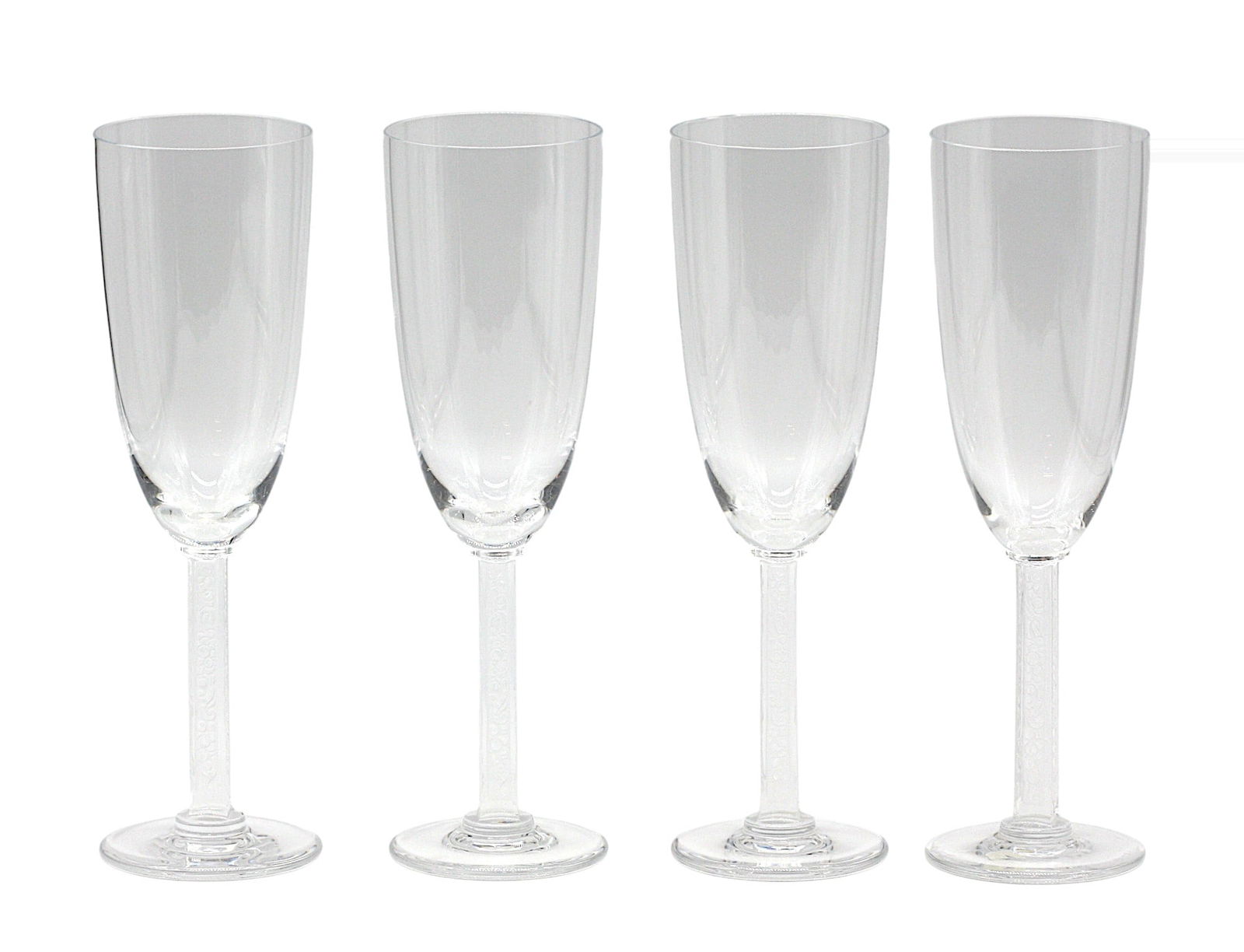 Set of Four Lalique Colorless Crystal Champagne Flutes: Set of Four Lalique Colorless Crystal Champagne Flutes. Etched signature Lalique France. Each tapered cylindrical bowl on a squared stem pierced on all sides with open scrollwork, on a circular foot.