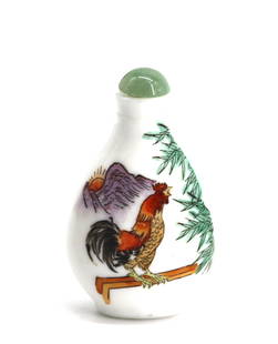 Chinese Enamel Decorated Porcelain Snuff Bottle: Chinese Enamel Decorated Porcelain Snuff Bottle The underside with three-character marks in red, of tear drop form painted with a fanciful rooster before a sparse mountainous landscape, with jade cap