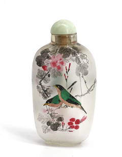 Chinese Reverse Painting on Glass Snuff Bottle: Chinese Reverse Painting on Glass Snuff Bottle The elongated ovoid bottle decorated on each side with a pair of songbirds on blossoming branches, with a jade cap and a spoon. Height 3 in. Snuff
