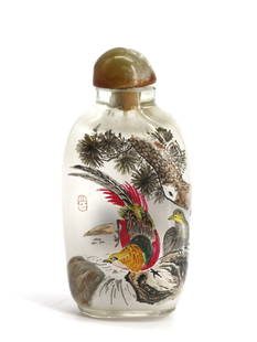 Chinese Reverse Painting on Glass Snuff Bottle: Chinese Reverse Painting on Glass Snuff Bottle The elongated ovoid bottle decorated with two ducks on a lake, with inscribed, signed verse above, the reverse with a male and female Chinese pheasant,