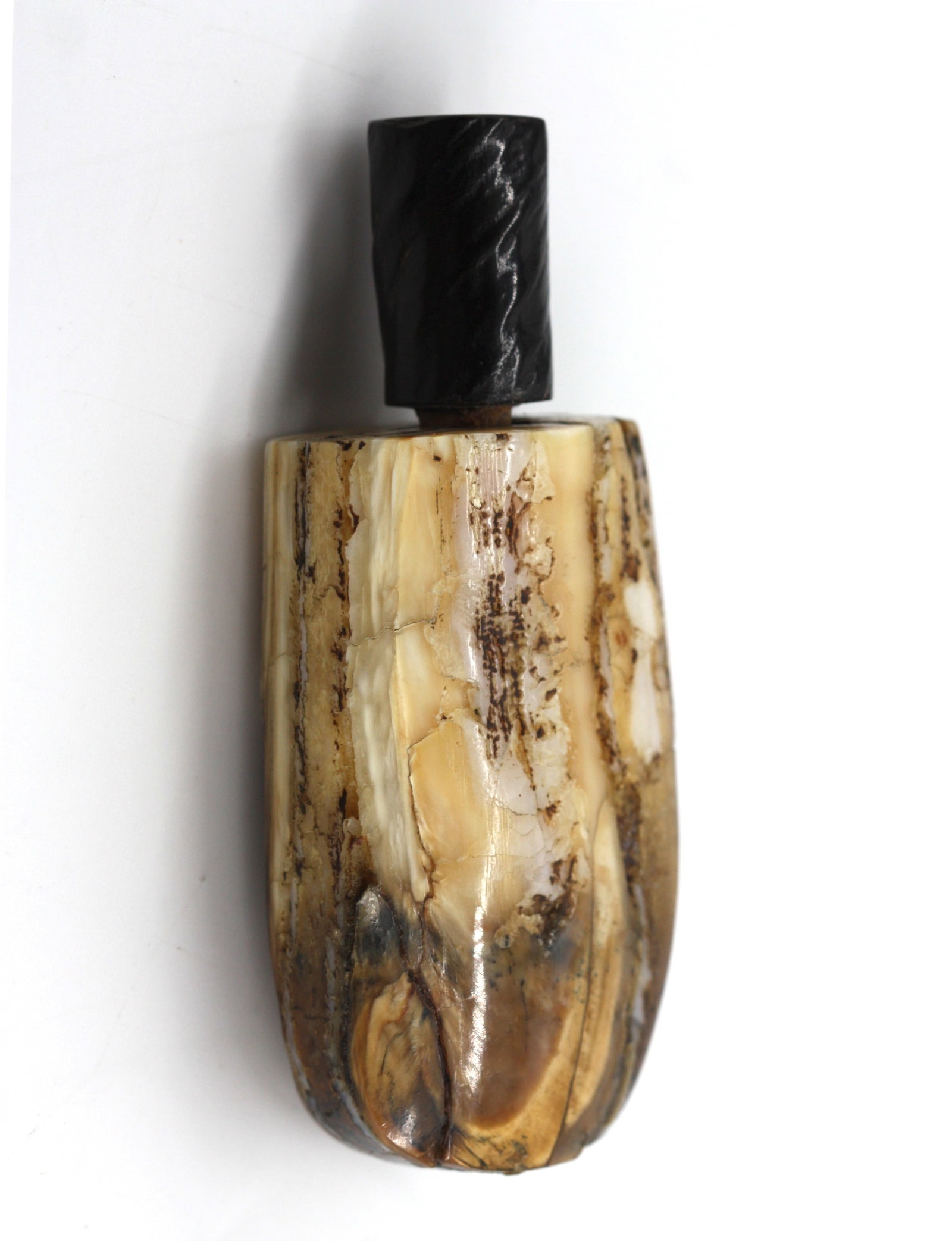 Chinese Calcified Bone Snuff Bottle: Chinese Calcified Bone Snuff Bottle The oblong vessel varied in color with an ebonized branch-form wood cap with spoon. Height 3.5 in. Snuff bottles were personal objects of luxury and artistry during