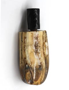 Chinese Calcified Bone Snuff Bottle: Chinese Calcified Bone Snuff Bottle The oblong vessel varied in color with an ebonized branch-form wood cap with spoon. Height 3.5 in. Snuff bottles were personal objects of luxury and artistry