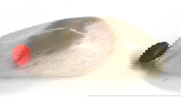 Chinese Pebble-Form Quartz Snuff Bottle: Chinese Pebble-Form Quartz Snuff Bottle The asymmetrical body with a mottled smokey brown inclusion, with a coral cap and scoop. Height 3 in. Snuff bottles were personal objects of luxury and