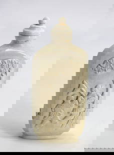 Chinese Carved Master Snuff Bottle: Chinese Carved Master Snuff Bottle The chamfered footed rectangular body carved on one side in high relief to depict a teacher and his pupil, the reverse etched with a signed verse and a female