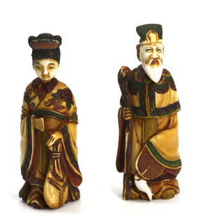 Pair of Chinese Carved and Painted Figural Snuff Bottles: Pair of Chinese Carved and Painted Figural Snuff Bottles Depicting either a noble man or woman, elaborately dressed, their heads forming the caps, with scoops. Height 3 in. Snuff bottles were