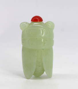Chinese Pale Celadon Jade Cicada-Form Snuff Bottle: Chinese Pale Celadon Jade Cicada-Form Snuff Bottle Projecting wings, and with a carved underside and large circular eyes, with a red resin cap.. Length 2.75 in. Snuff bottles were personal
