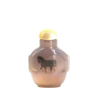 Fine Chinese Carved Shadow Agate Snuff Bottle: Fine Chinese Carved Shadow Agate Snuff Bottle The ovoid footed body of translucent gray color with a natural brown inclusion of a stylized horse, the sides carved with stylized mask and ring handles,