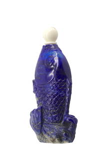 Chinese Fish-Form Lapis Lazuli Snuff Bottle: Chinese Fish-Form Lapis Lazuli Snuff Bottle The cobalt blue body naturalistically carved with scales, the lower part with rockwork, with bead cap, and a scoop. Height 2.5 in. Snuff bottles were