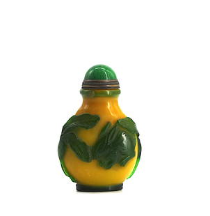 Good Chinese Cameo Cut Peking Glass Snuff Bottle: Good Chinese Cameo Cut Peking Glass Snuff Bottle The circular yellow opaque body overlaid in green and cut to depict on each side a rabbit nibbling on leaves, with a domed green mineral cap, with