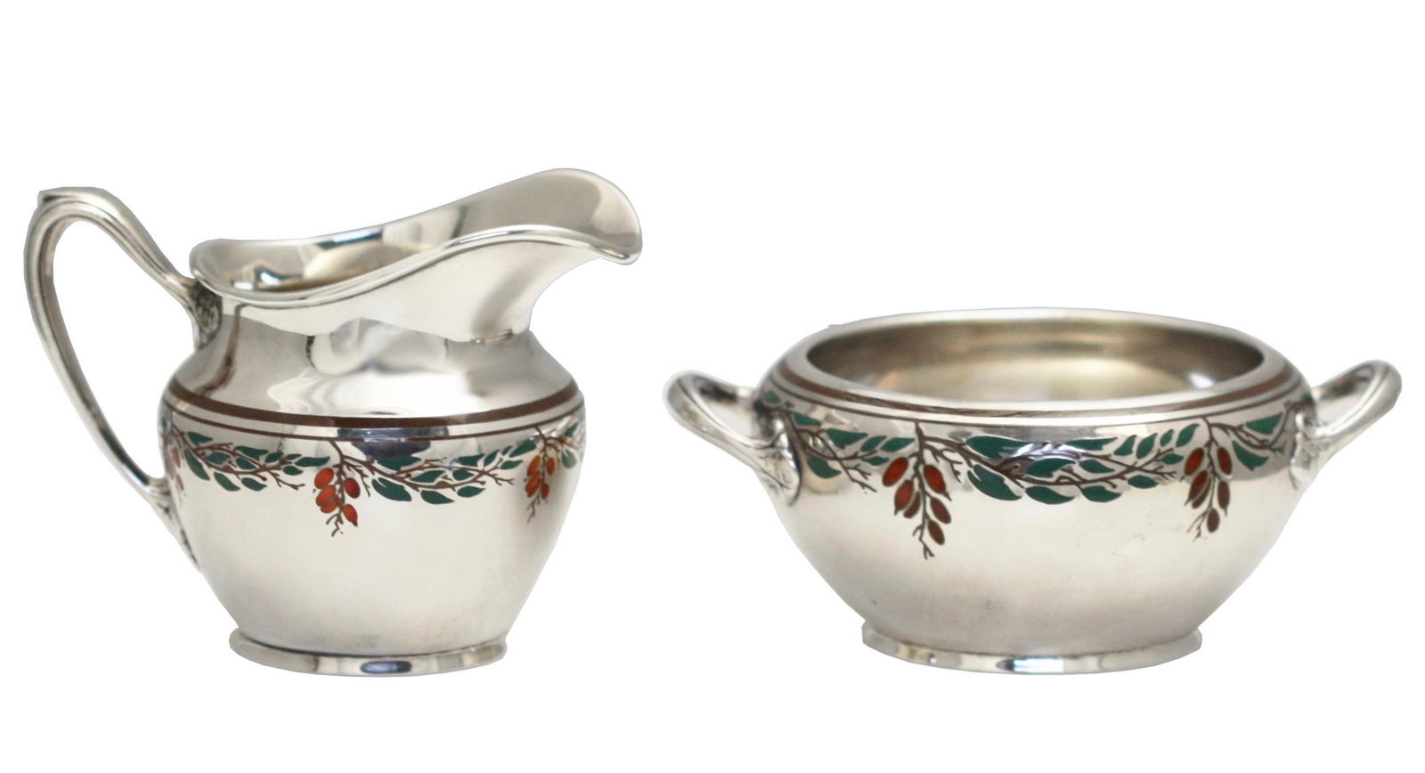 Sterling Silver Enamel Inset Creamer & Sugar Bowl: Sterling Silver Enamel Inset Creamer & Sugar Bowl br>Probably English, early 20th Century. Marked with maker and sterling, 8264. Each with a band on enamel foliage. Height of creamer 2.75 in. (6.98