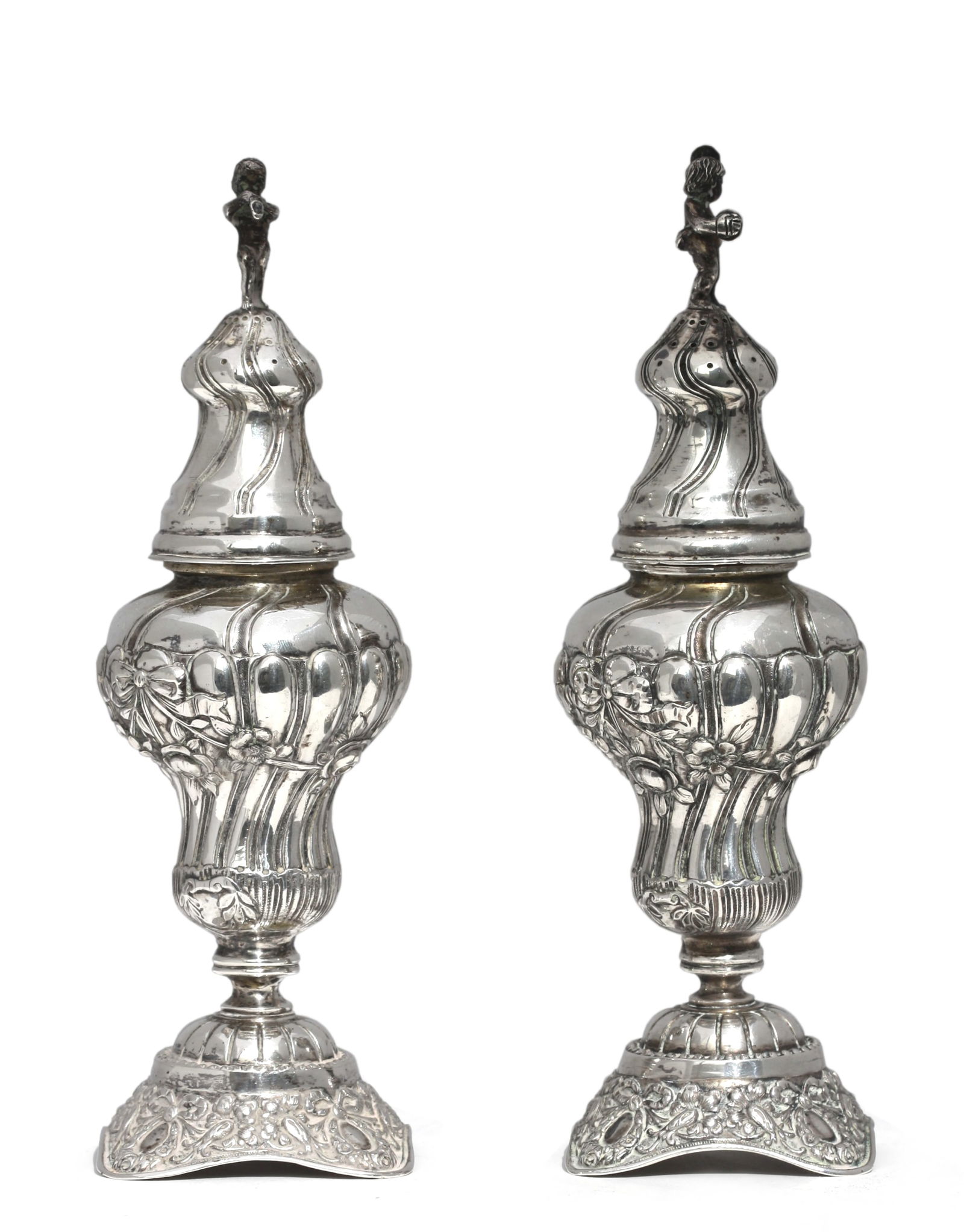 Pair of Continental Silver Covered Spice Vessels: Pair of Continental Silver Covered Spice Vessels Probably German, mid to late 19th Century. Each tapering bulbous body chased with bow-tied flower garlands and spiral reeds, on a shaped square base