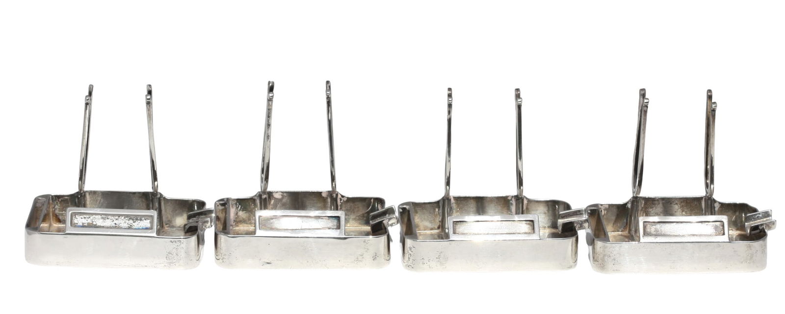 Set of Four Cartier Sterling Silver Place Card Holders: Set of Four Cartier Sterling Silver Place Card Holders Marked Cartier in script, Sterling 925. Rectangular with lyre-form card supports. Width 3 in. (7.62 cm.), 12.1 troy ozs.