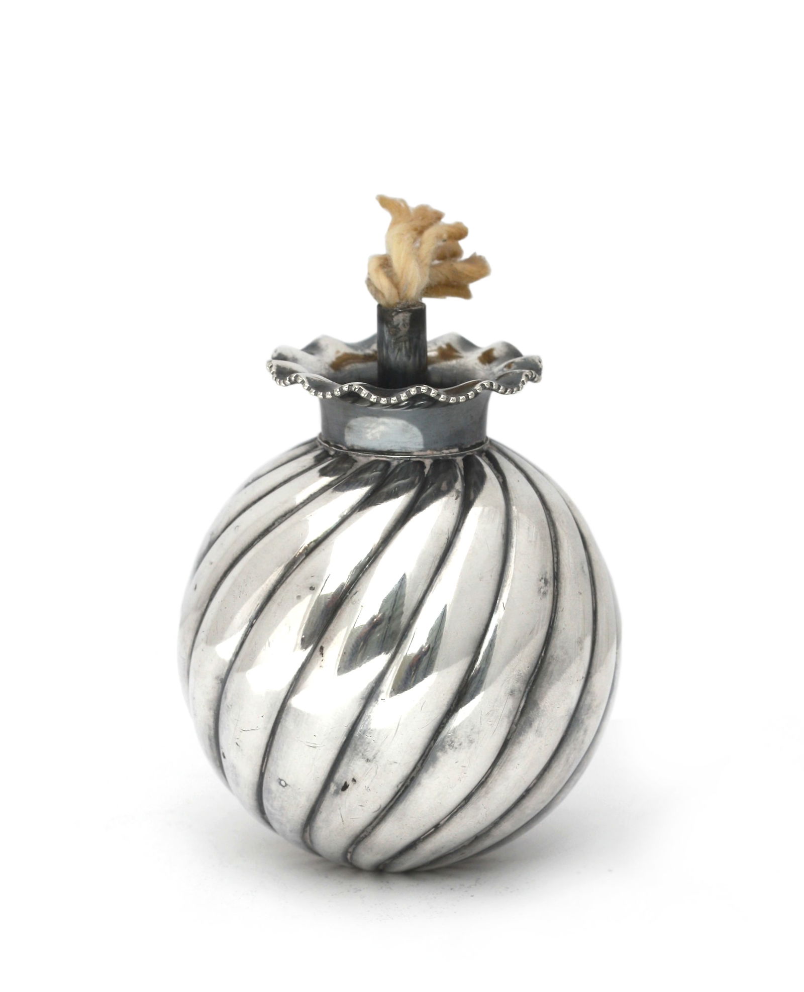 Tiffany & Co. Silver Plate Lighter: Tiffany & Co. Silver Plate Lighter Marked Tiffany & Co., with numerals and E.P. The spiraled spherical body with a ruffled rim centering a wick. Height 3 in. (7.62 cm.)