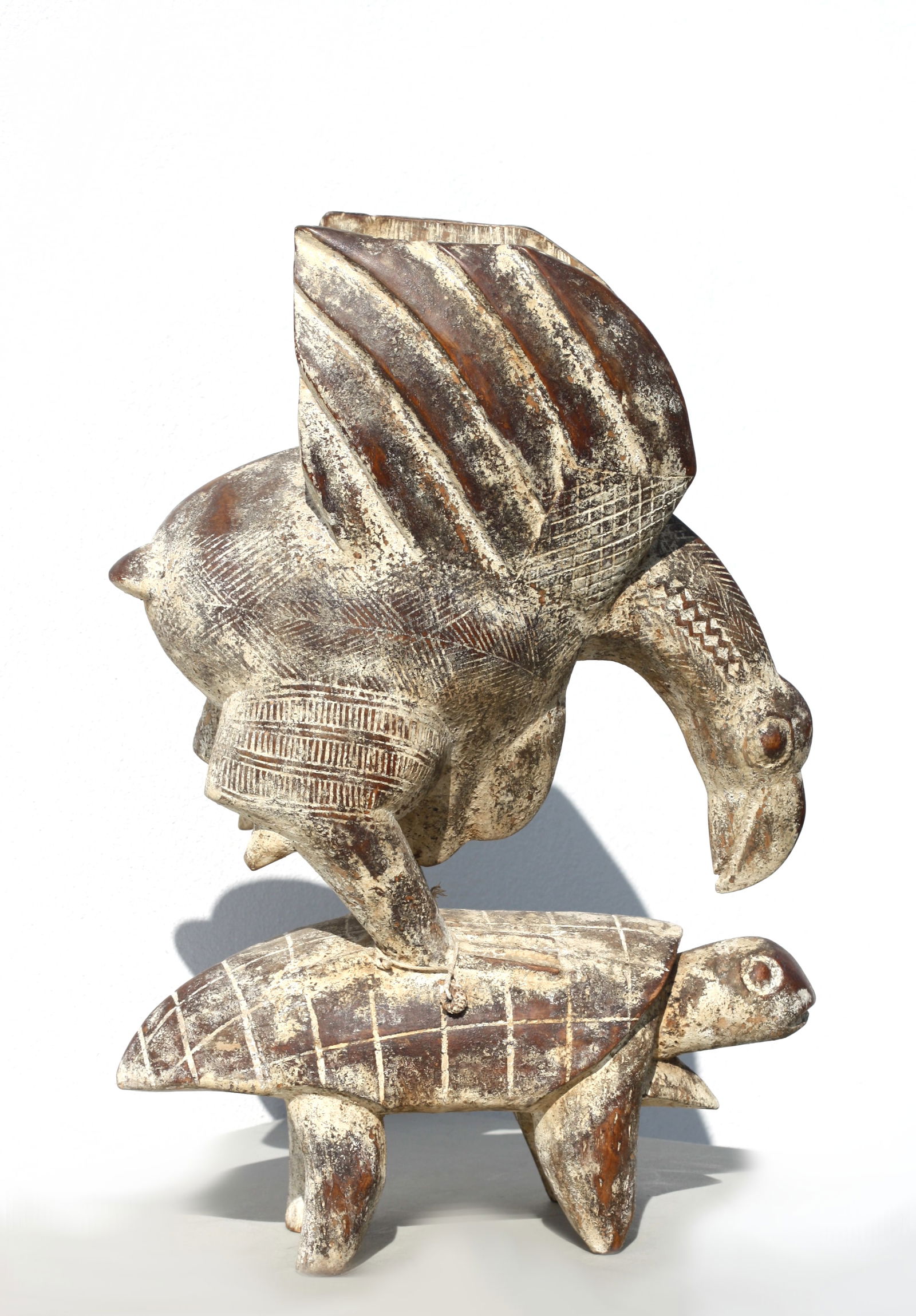 Baule Peoples Royal Proverb Judgment Totem, Ivory Coast: Baule Peoples Royal Proverb Judgment Totem, Ivory Coast Carved wood in form of bird with wings spread open, standing on the back of a turtle with dark brown patina and kaolin, glass seed beads and bra