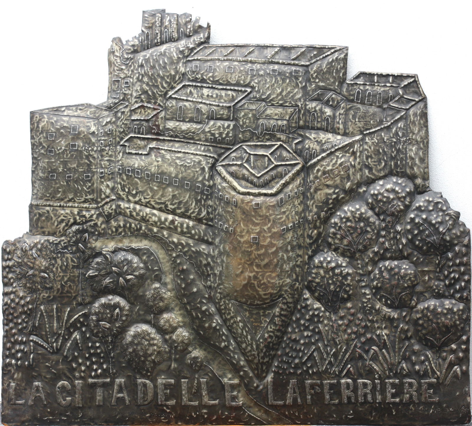 Gerard La Torture, Bien Pro Prietaire Prive, Cut Metal: Gerard Latorture, Bien Pro Prietaire Prive 20th Century, French/Haitian. Titled "La Citadelle La Ferrierre", a metal alloy relief of a Citadelle,,the reverse with artist's plaque, reading "BIEN PRO PR
