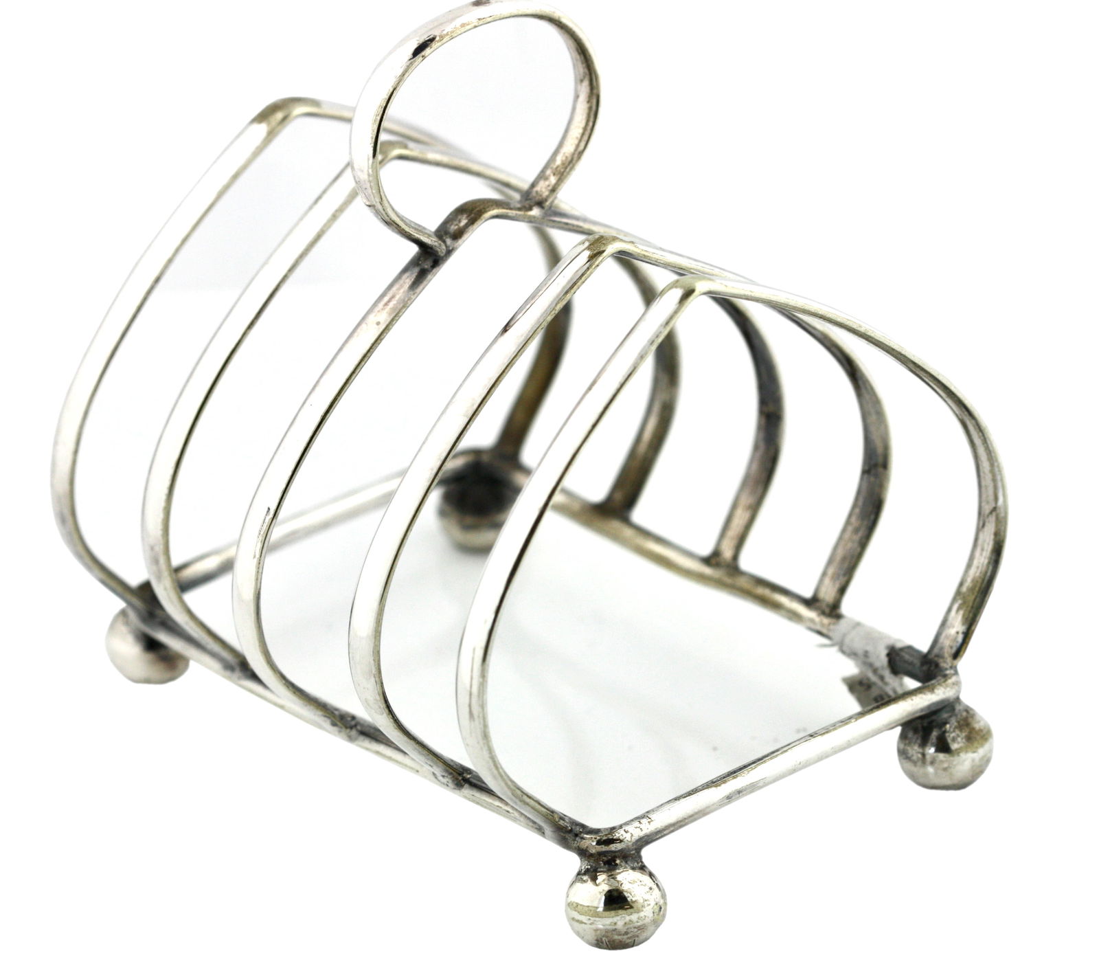 English Silver Plate Toast Rack: English Silver Plate Toast Rack Late 19th Century. Stamped: E.P.N.S. With a loop handle and four bun feet. Height 4.25 in., Width 4 in.