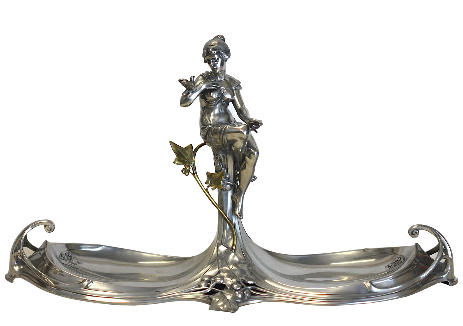 Continental Art Nouveau Silvered Metal Centerpiece: Continental Art Nouveau Silvered Metal Centerpiece Unmarked, probably WMF. The classically clad maiden with a bird, atop a pedestal with a brass fitted berried twig, continuing to a double-dished