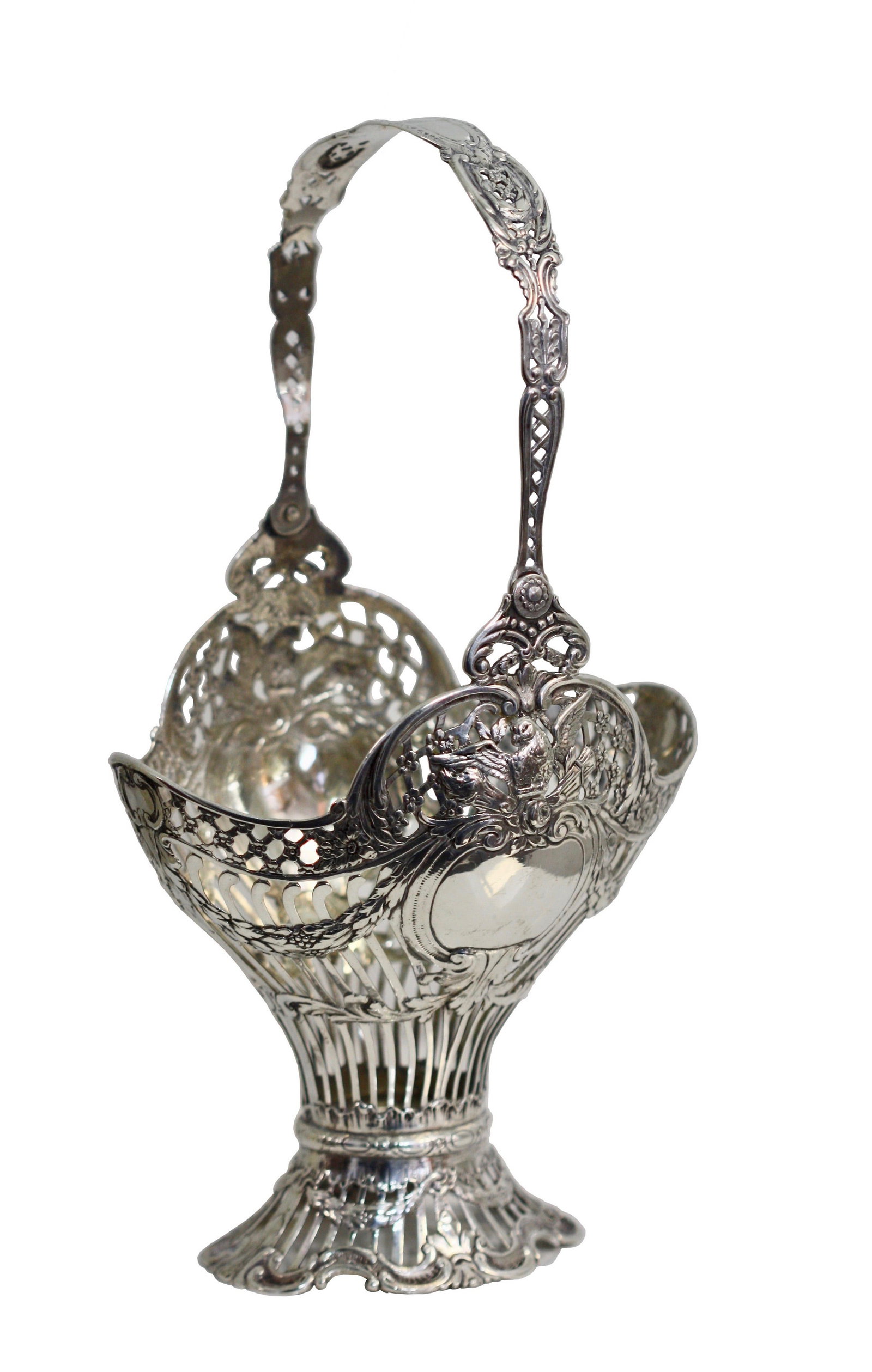 Fine Continental Silver Pierced Basket with Doves and Swing Handle: Fine Continental Silver Pierced Basket with Doves and Swing Handle A finely crafted Continental silver basket of elegant pierced foliate design, each side centered by a dove perched above a vacant car