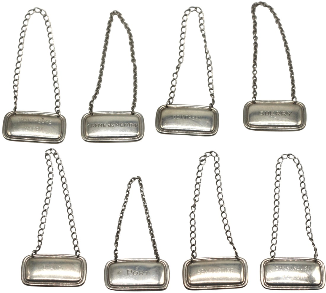 Tiffany & Co., Set of Eight Sterling Silver Decanter Labels: Tiffany & Co., Set of Eight Sterling Silver Decanter Labels; American, circa 1930 A refined and elegant set of eight sterling silver decanter labels by Tiffany & Co., each finely crafted in classic