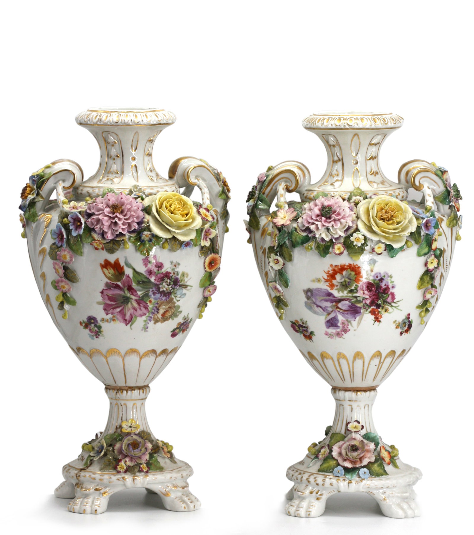 Pair of Capodimonte Porcelain Urns: Pair of Capodimonte Porcelain Urns Each marked with a crowned N, circa 1900. Each vase-shaped vessel with scrolled handles and mounted with colorful flowers, one side reserved with a painted amours co