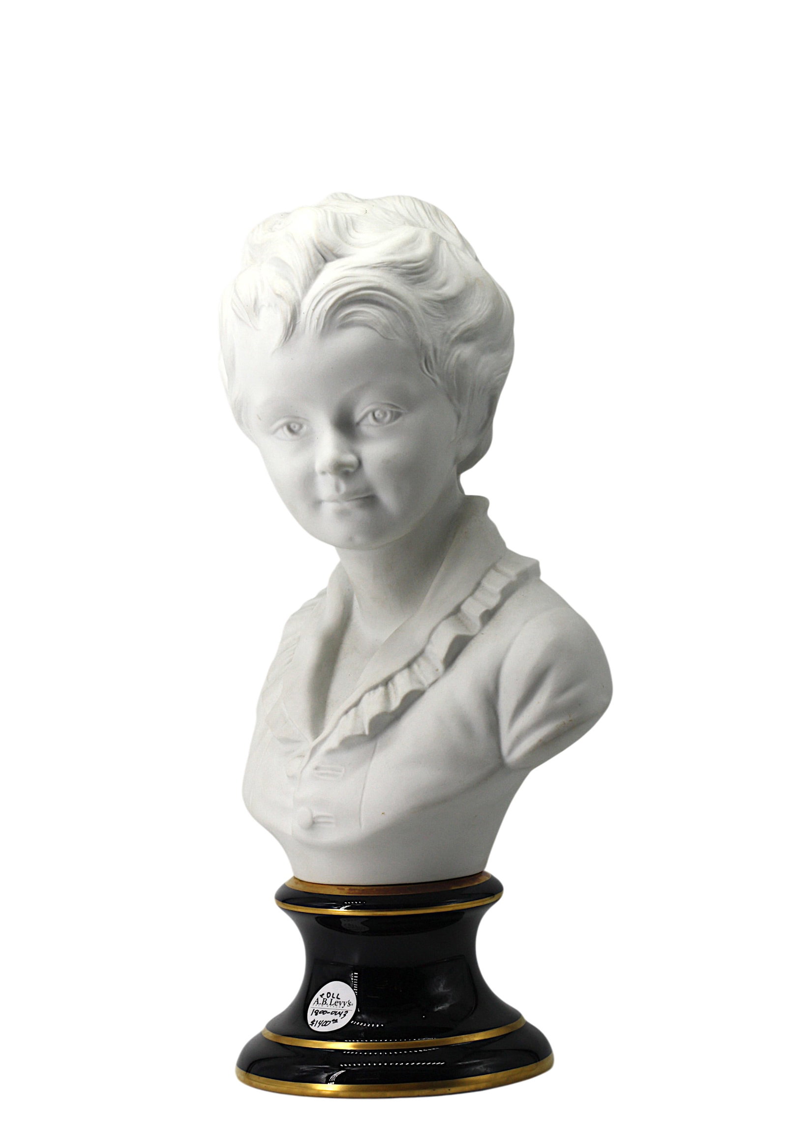French Biscuit Porcelain Bust of a Boy: French Biscuit Porcelain Bust of a Boy The underside signed Tharaud, France. The boy with a serious gaze, well-coiffed hair and in a ruffled frock, on a gilt decorated cobalt blue porcelain base. Heig