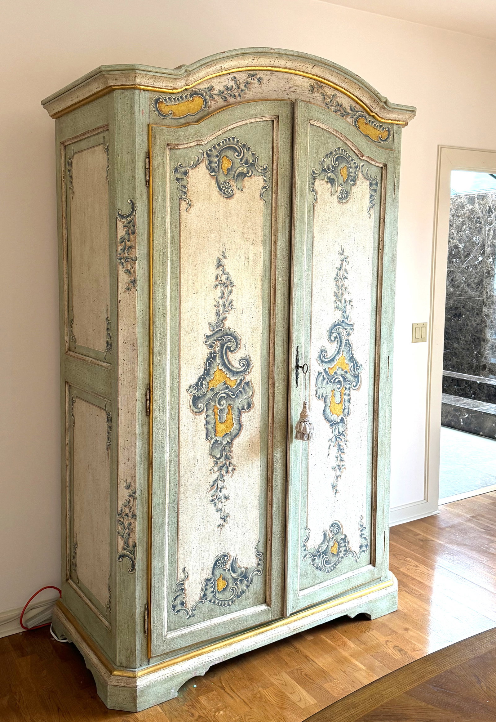 Italian Rococo Style Painted Armoire: Italian Rococo Style Painted Armoire The molded arched crest above two shaped inset paneled doors, opening to a contemporary- fitted interior, on a conforming shaped base, painted with blue C-scrools