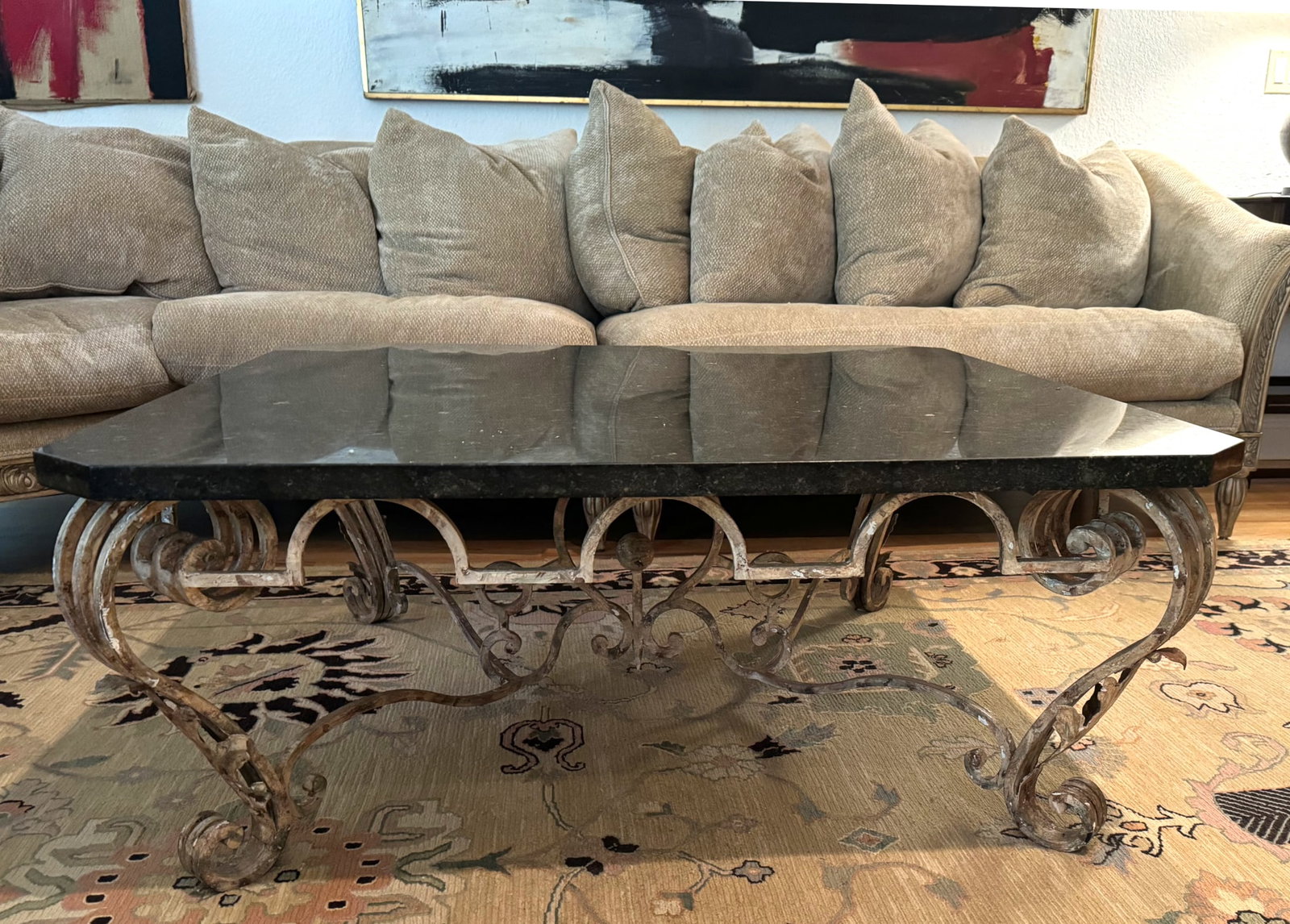 Contemporary Marble Top Painted Wrought Iron Low Table: Contemporary Marble Top Painted Wrought Iron Low Table The white speckled black top with canted corners, above a scrolled wrought iron frieze and legs. Height 18 in., Width square 44 in.