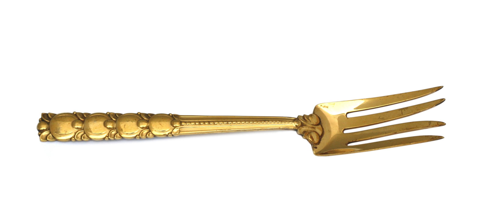 Tiffany & Co. Sterling Gilt Silver Serving Fork: Tiffany & Co. Sterling Gilt Silver Serving Fork Marked, Tiffany & Co, Sterling. In the Tomato / Exhibition pattern. The handle cast with graduating stylized circular and bead motifs, monogrammed. 3.9 