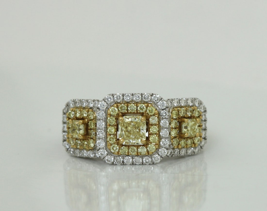 Three-Stone Diamond Ring: Elegant Three-Stone Diamond Ring crafted in 18K gold, featuring a stunning center brilliant-cut diamond weighing approximately 0.50 carat, accented by two additional brilliant-cut diamonds weighing ap