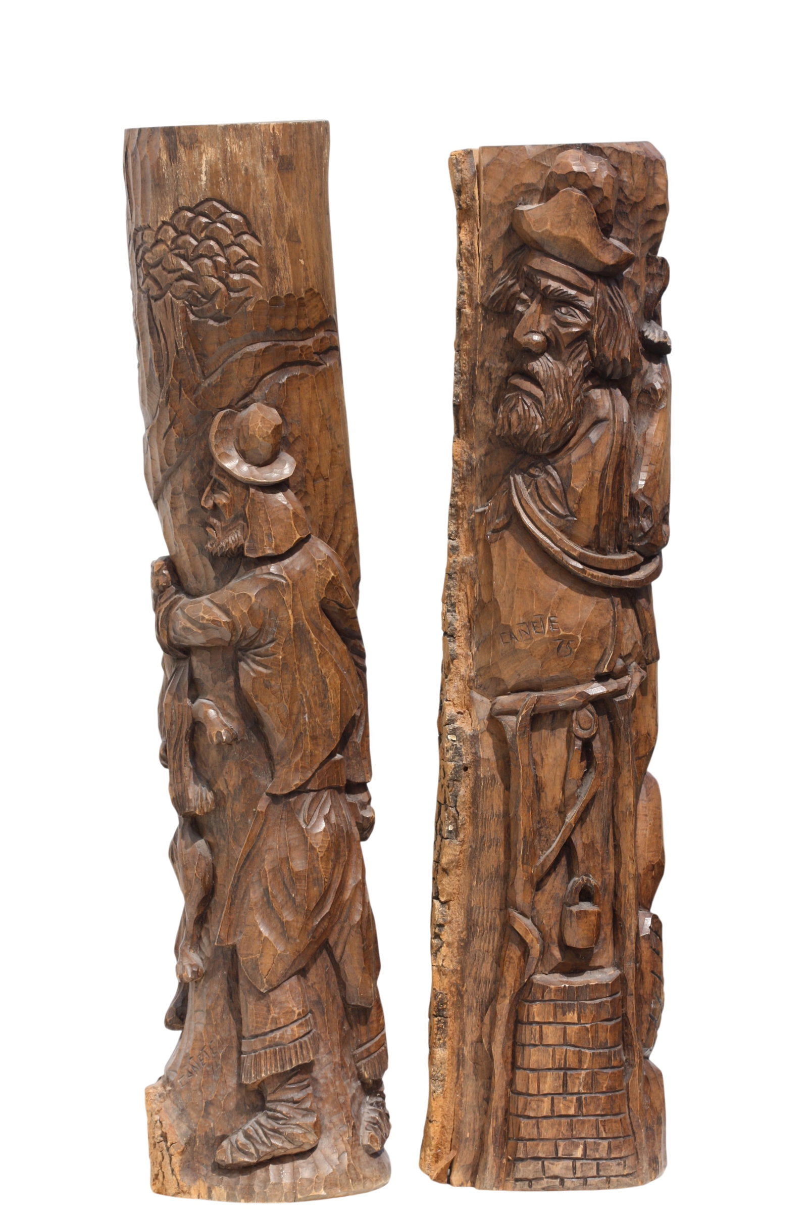 Two Peruvian Canete Carved Hardwood Wood Figural Carvings: Two Peruvian Canete Carved Hardwood Wood Figural Carvings Signed Canete, 1974-1975, one depicting a cowboy with his horse, the other a man with a bobcat. Height 33 in., Diameter 7 in.