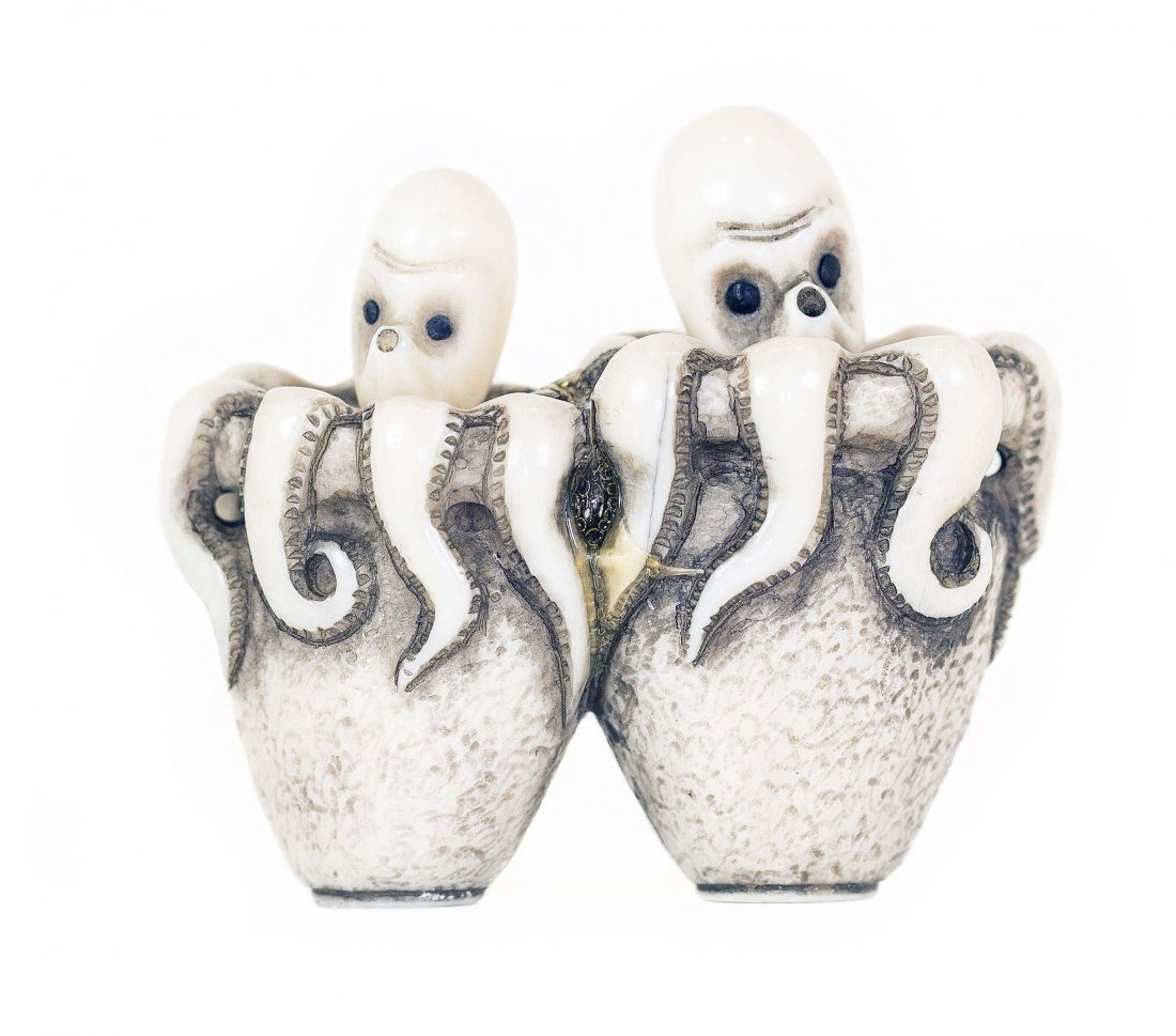 CARVED IVORY NETSUKE: PROPERTY FROM A FLORIDA COLLECTION CARVED IVORY NETSUKE Signed. Of octopus pods with the eight legged characters peeking out with articulated heads. Length 1 3/4 inches.