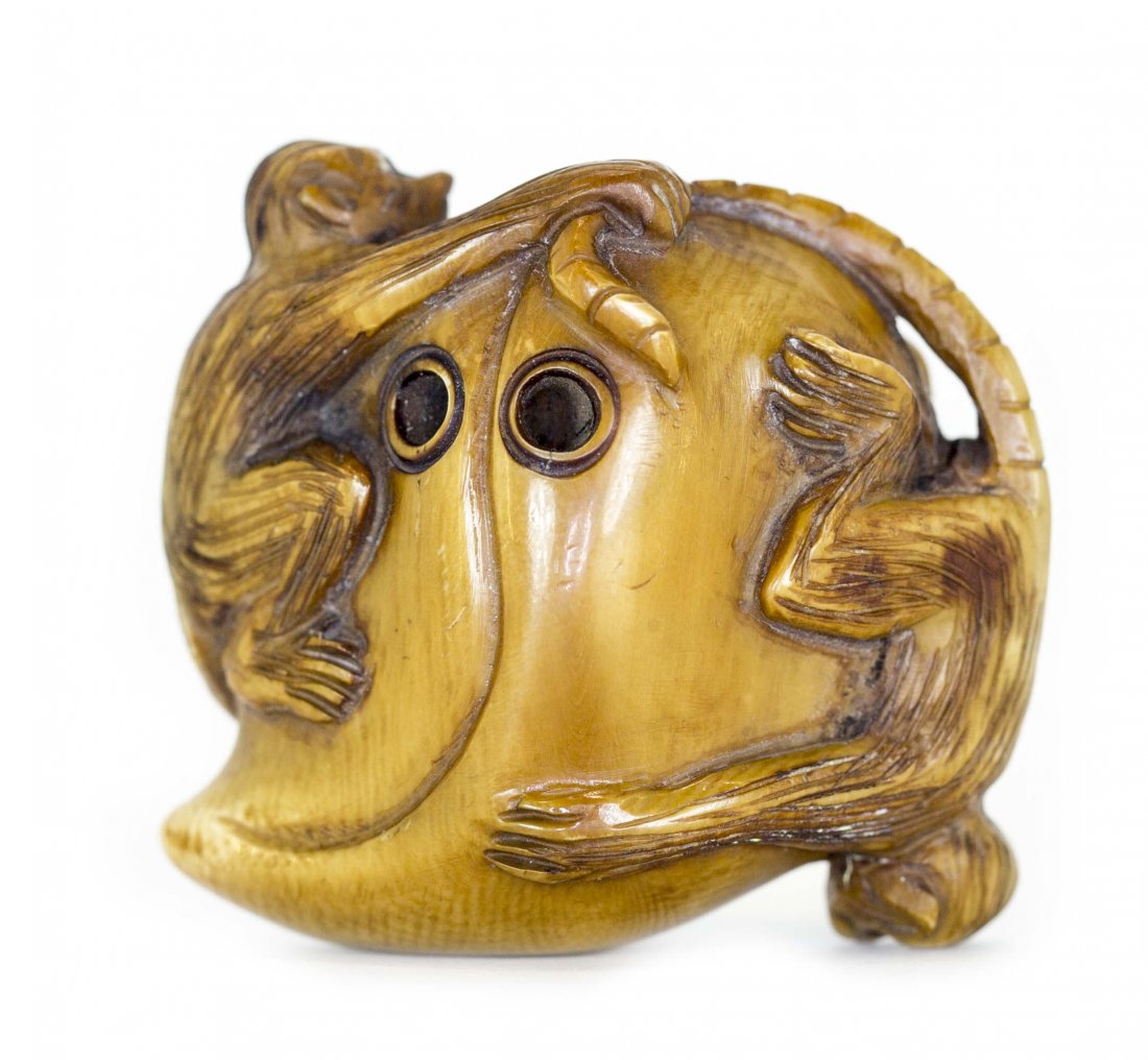 JAPANESE CARVED IVORY NETSUKE, Meiji Period (1868-1912): PROPERTY FROM A FLORIDA COLLECTION JAPANESE CARVED IVORY NETSUKE Meiji Period (1868-1912). Of a peach with two monkeys. Height 1 3/4 inches.