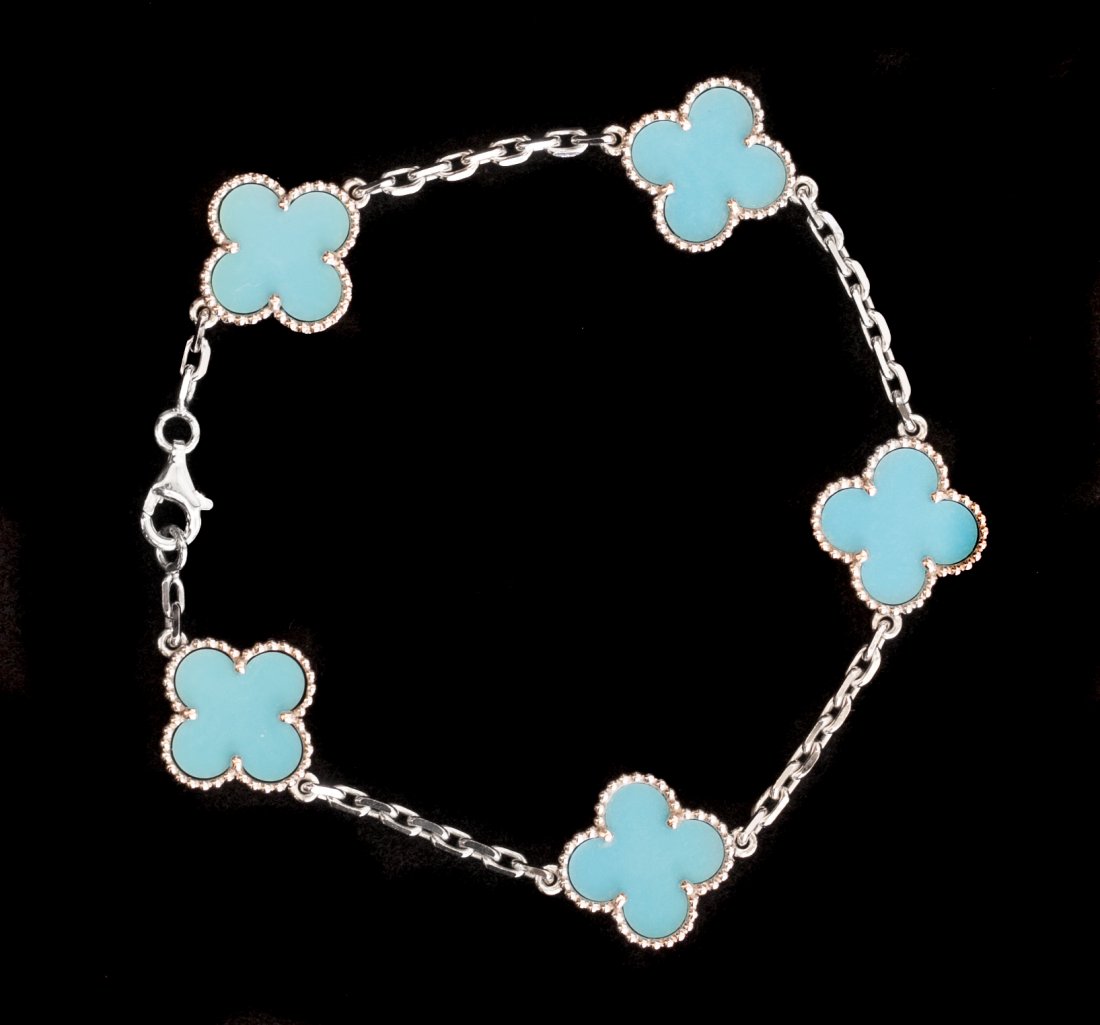 VAN CLEEF AND ARPELS ALHAMBRA BRACELET: VAN CLEEF AND ARPELS ALHAMBRA BRACELET Signed Van Cleef and Arpels. Composed of five sections of turquoise set in 18K white gold. Accompanied by original outer and inner boxes.