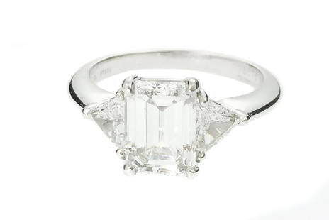 TIFFANY & CO. PLATINUM AND 2.05CT DIAMOND RING: TIFFANY & CO. PLATINUM AND DIAMOND RING Stamped Tiffany & Co., TT950, and numbered D28575, 2.05 CT. Centered by an emerald cut diamond, weighing 2.05 carats, flanked by two trillion cut diamonds, weig