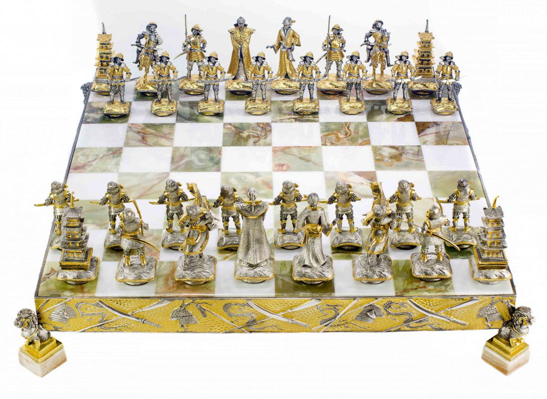 SAMURAI THEMED GOLD AND SILVER PLATED BRONZE CHESS SET: SAMURAI THEMED GOLD AND SILVER PLATED BRONZE CHESS SET 21st Century. Signed. The chessboard is made of onyx and embedded in a handcrafted 24kt gold-plated and silver-plated solid bronze base. Board Me