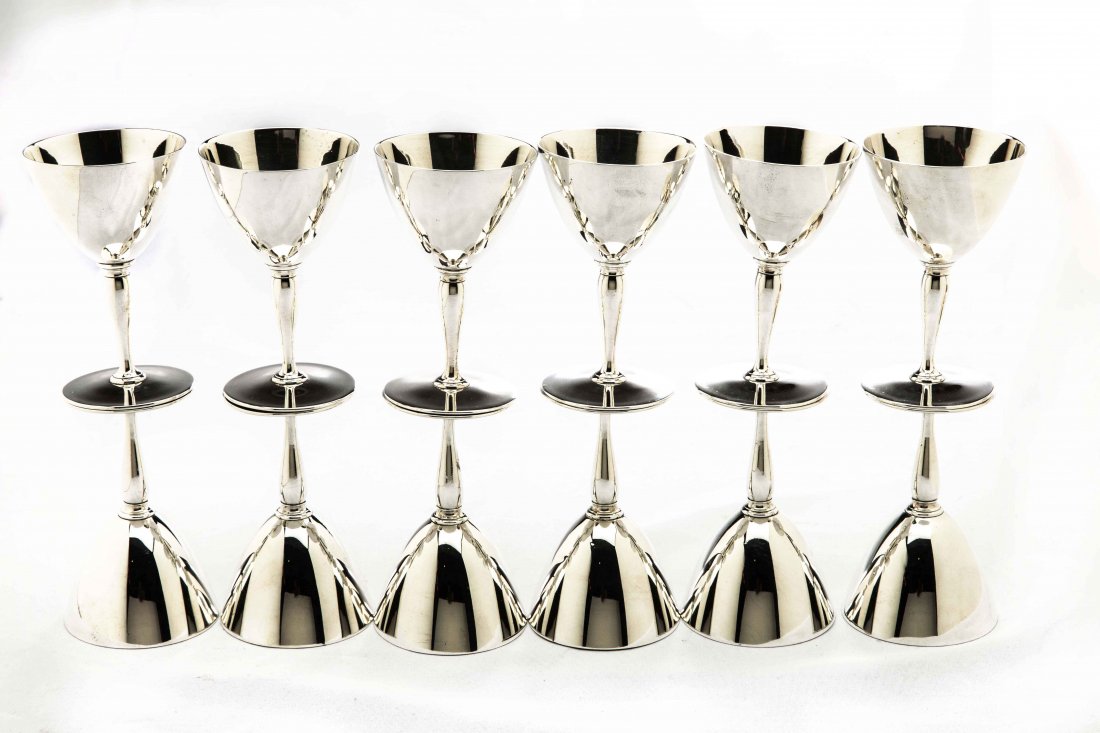 SET OF TWELVE TIFFANY & CO. SILVER STEM CUPS: SET OF TWELVE AMERICAN SILVER STEM CUPS 20th Century. Maker: Tiffany & Co. Each with a case shaped stem supporting the cup on a conforming circular base. Height 4 in. Weighing approximately 33 oz t.