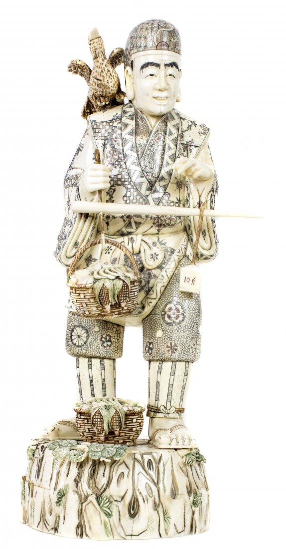 CHINESE CARVED BONE FIGURE: NO RESERVE - NO MINIMUM CHINESE CARVED BONE FIGURE Of a man standing on a rock-work base, holding a basket in one hand, with a bird perched on his shoulder. Height 23 in. Width 10 in. Depth 7 ½ in.