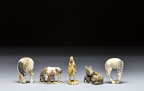 FOUR CARVED IVORY NETSUKE: FOUR CARVED IVORY NETSUKE Heights ranging from 2 in. (5.1 cm.) to 1 1/8 in. (2.7 cm.)