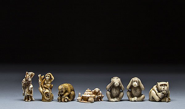 SEVEN CARVED IVORY NETSUKE: SEVEN CARVED IVORY NETSUKE The first netsuke of of a samurai monkey grabbing his sword and scratching his head, the second netsuke of a monkey sitting atop a tree stump with one hand on his head, the 