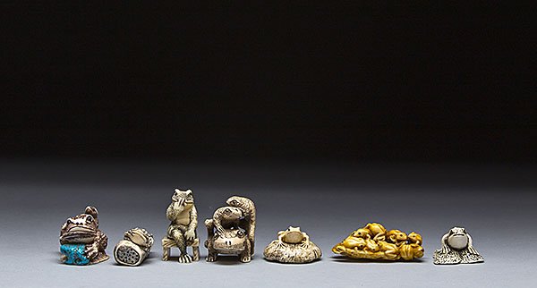SEVEN CARVED IVORY NETSUKE OF FROGS & TOADS: COLLECTION OF SEVEN CARVED NETSUKE OF FROGS & TOADS Heights ranging from 1 3/8 in. (3.5 cm.) to 3/4 in. (1.9 cm.)