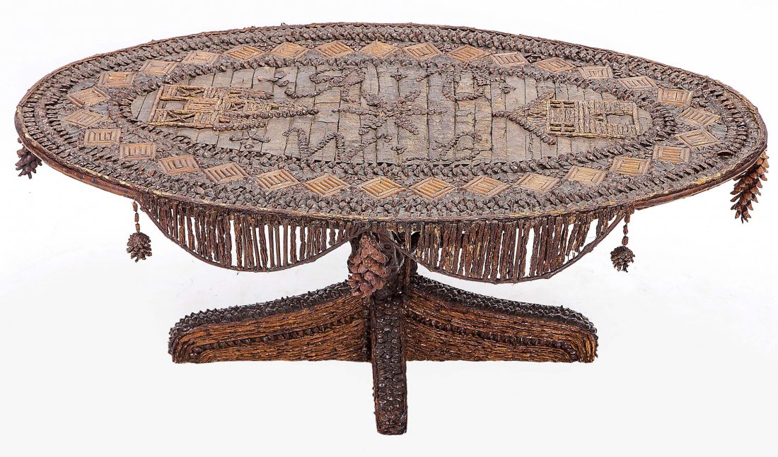 AMERICAN TRAMP ART OVAL LOW TABLE, EARLY 20TH C.: AMERICAN TRAMP ART OVAL LOW TABLE, early 20th century, the oval top with a double monogram RV and WB, depicting two 19th century facades of forts, with split twig and pine seed banding, hung with pine