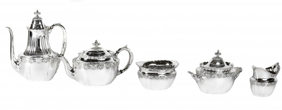 TIFFANY & CO. STERLING SILVER FIVE-PIECE TEA & COFFEE: TIFFANY & CO. MAKERS STERLING SILVER COFFEE AND TEA SERVICEPattern no. 9579, Circa 1891-1902 Comprising a coffee pot, teapot, two-handled covered sugar bowl, creamer and a waste bowl, each decorated w
