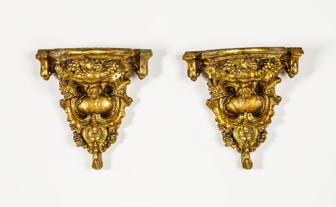 PAIR OF LOUIS XV STYLE GILT WOOD BRACKETS: PAIR OF LOUIS XV STYLE GILT WOOD BRACKETSLate 19th Century Each of typical form carved allover with foliage and scrolls. One with restored corner. Height 14 in., Depth 8 in.
