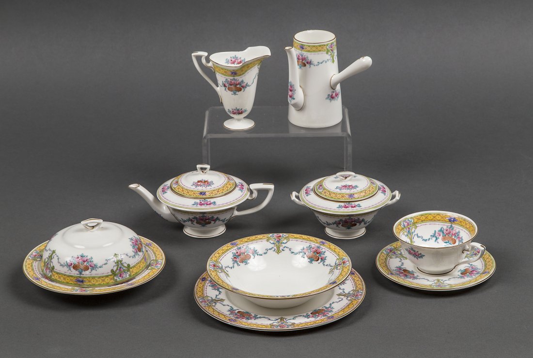 ENGLISH PARCEL GILT PORCELAIN TEA AND COFFEE SERVICE: ENGLISH PARCEL GILT FOLIATE DECORATED TEN-PIECE PORCELAIN SOLITAIRE TEA AND COFFEE SERVICEEarly 20th Century Royal Worcester, with factory marks, each with a yellow band decorated with colorful foliag