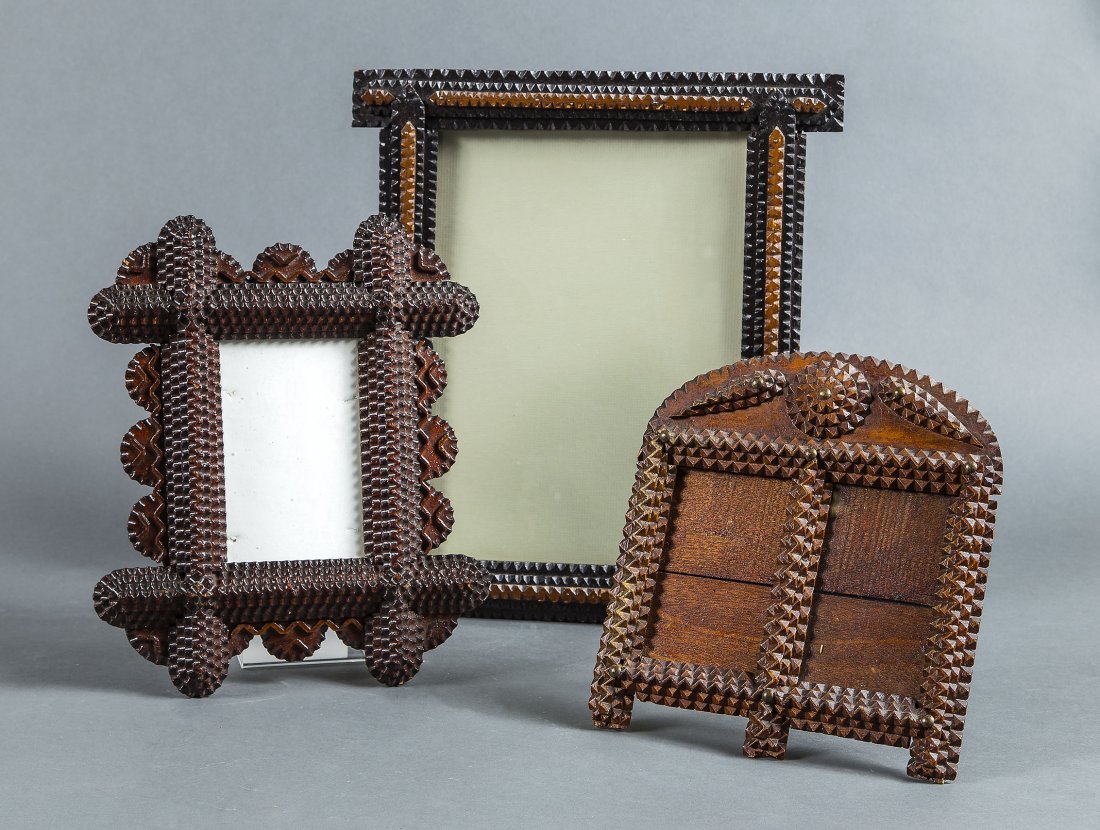 THREE AMERICAN TRAMP ART FRAMES, CIRCA 1900: THREE AMERICAN TRAMP ART FRAMES Circa 1900 Comprised of an arched crested double aperture example, a two-toned stained rectangular example with overlapping stiles and sides with demilune projections, 
