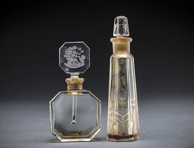 TWO PERFUME BOTTLES AND A LACQUER BOX: VINTAGE CZECH COLORLESS INTAGLIO CUT GLASS PERFUME BOTTLE, A VINTAGE FRENCH ACID ETCHED CUT COLORLESS GLASS PERFUME BOTTLE AND A SMALL LACQUER CIRCULAR COSMETIC/SNUFF BOX the bottles circa 1930 and un