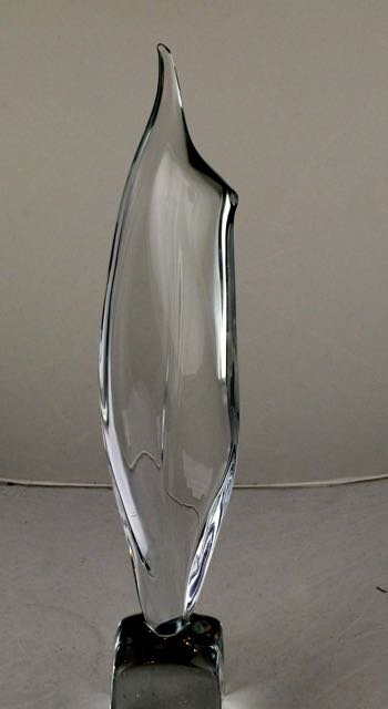 COLORLESS GLASS STYLIZED FLAME, DAUM FRANCE: Colorless Glass Stylized Flame,DAUM FRANCE Modern, signed DAUM France, in the form of a stylized flame. Height 15 in. (approx.)