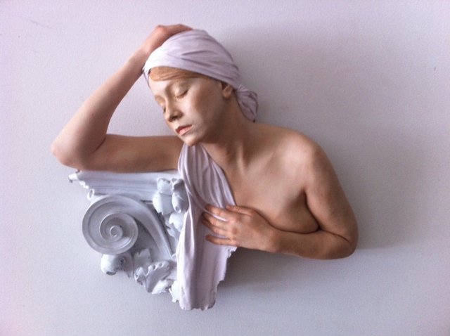 MARC SIJAN, (SERBIAN-AMERICAN, B. 1946) FEMALE RELIEF: MARC SIJAN (SERBIAN-AMERICAN, B. 1946) Untitled, A hyper-realistic composition relief of a woman poised on a column, signed on the reverse, numbered 6 of 20. 25 by 23 in.