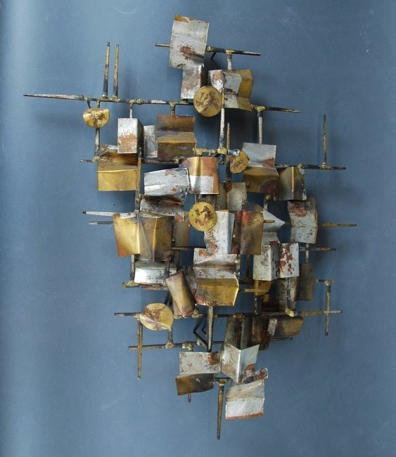 MID CENTURY GILT COPPER & BRASS WALL HANGING, JERE: MID CENTURY GILT COPPER AND BRASS WALL MOUNTED SCULPTURE, IN THE MANNER OF CURTIS JERE Circa 1965, composed of circular and rectangular cut copper panels affixed to variously sized posts. Height 29 in